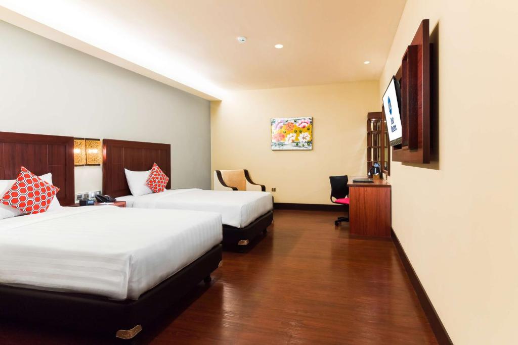 Postel nebo postele na pokoji v ubytování Best Western Senayan