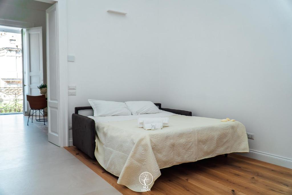 Postel nebo postele na pokoji v ubytování Sui Lecci