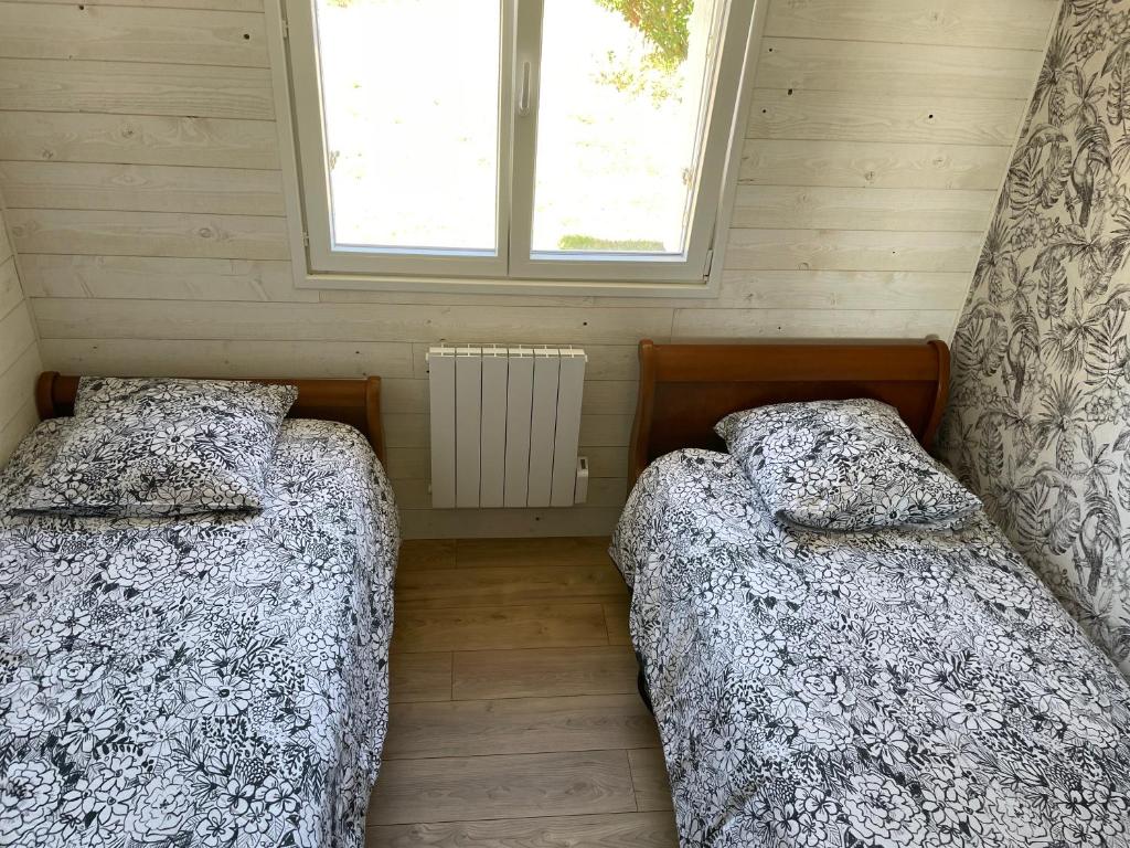 Posteľ alebo postele v izbe v ubytovaní Maison familiale et cosy