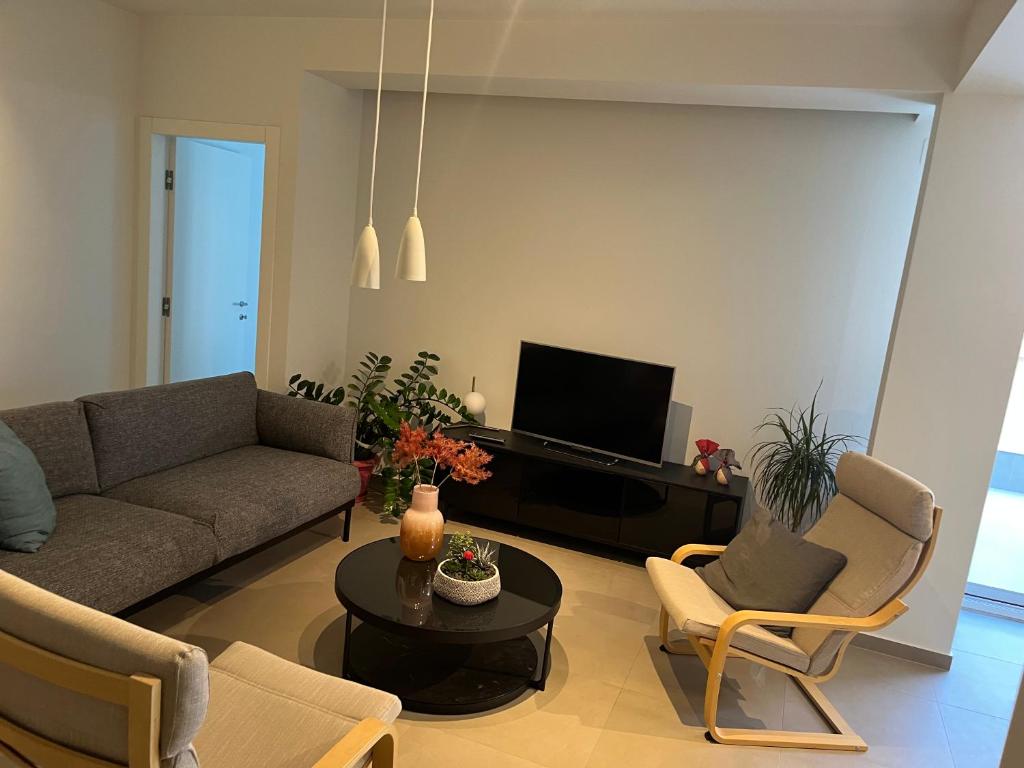 Posedenie v ubytovaní Fofi's City Center Apartment