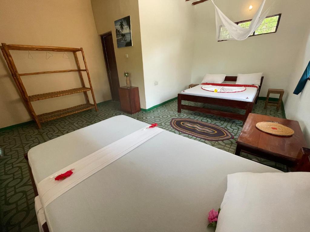 Postel nebo postele na pokoji v ubytování Botanica Eco Lodge