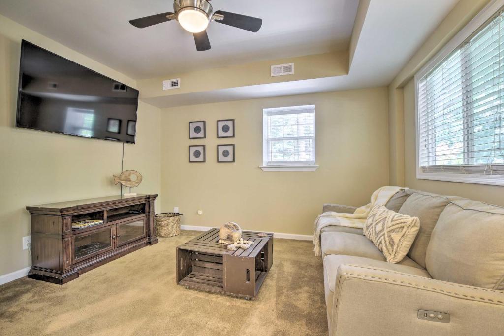 a living room with a couch and a ceiling fan at Cozy Pittsboro Escape - Hike, Dine, Explore! in Pittsboro