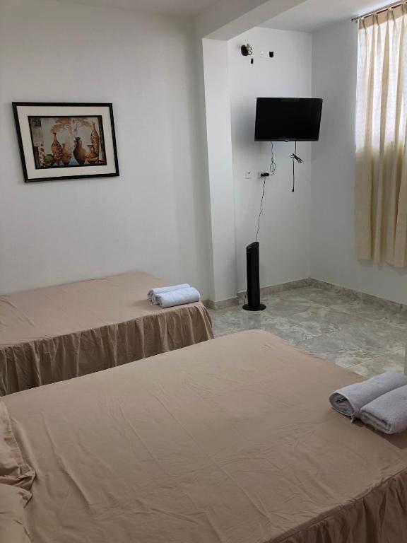 Postel nebo postele na pokoji v ubytování CASA SHILCAYO Habitaciones Vacacionales