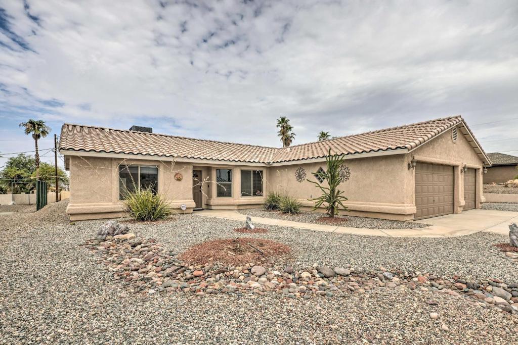 a house with a gravel driveway in front of it at Arizona Retreat with Casita about 2 Mi to Lake Havasu in Lake Havasu City