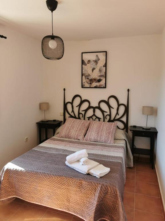 Postel nebo postele na pokoji v ubytování CASITAS PINILLA DEL VALLE