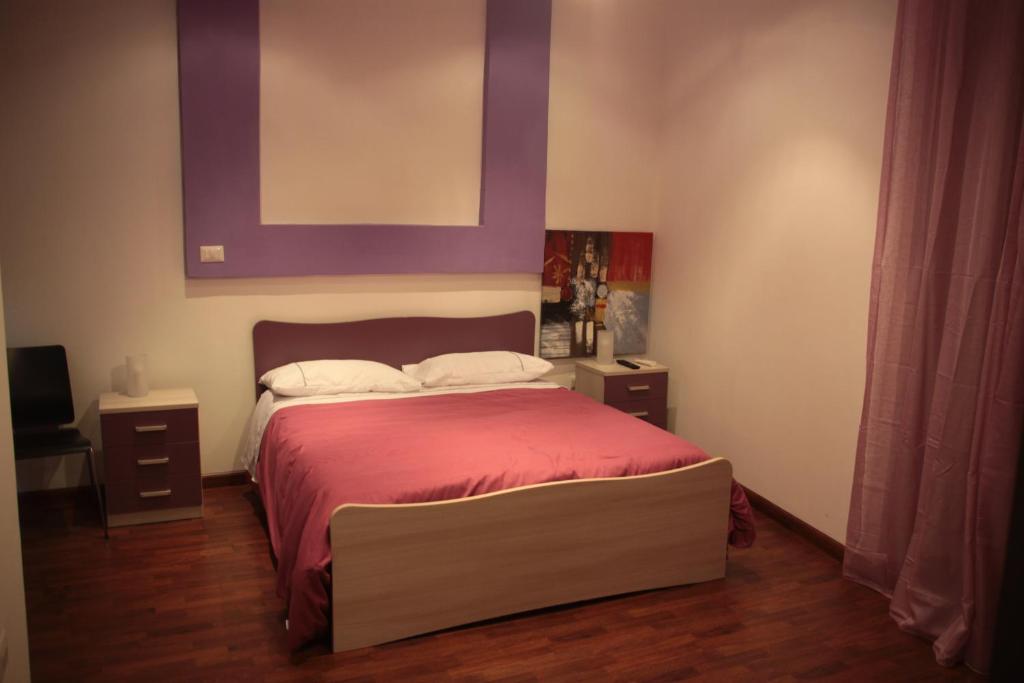 Posteľ alebo postele v izbe v ubytovaní B&B Cosenza