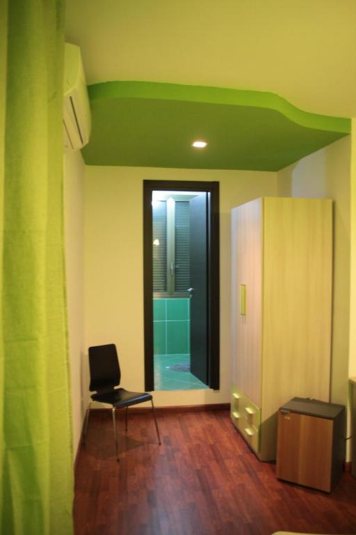 Televízia a/alebo spoločenská miestnosť v ubytovaní B&B Cosenza