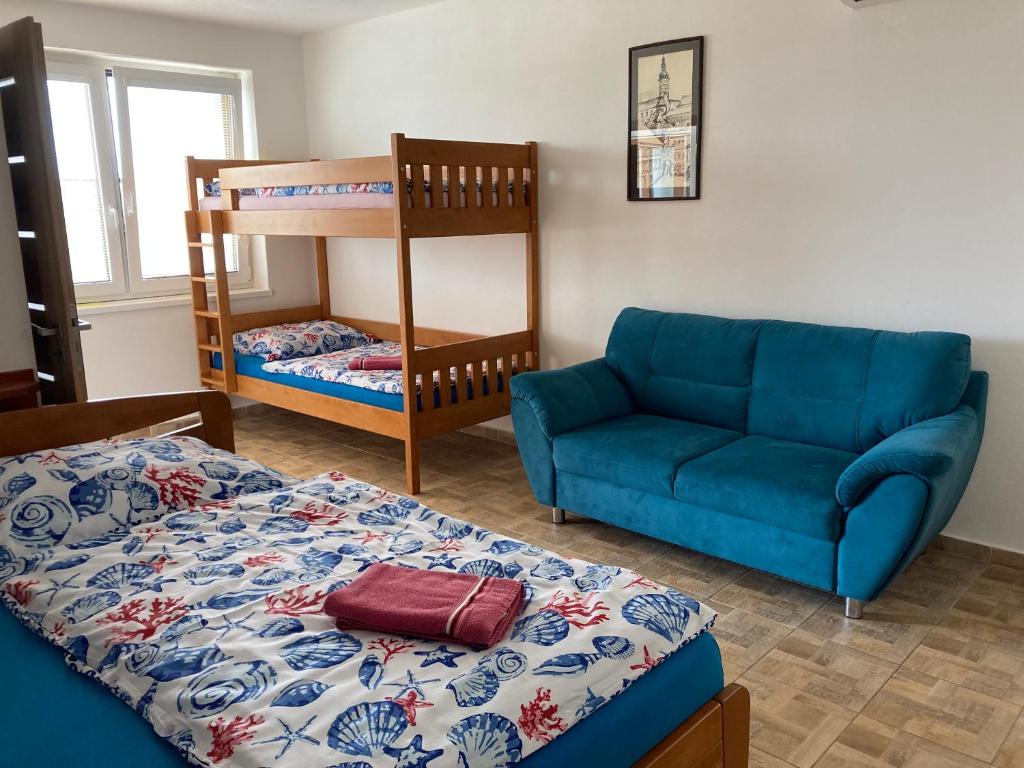 Postel nebo postele na pokoji v ubytování Apartmány s klimatizací - Penzion U Kudláčků Pouzdřany