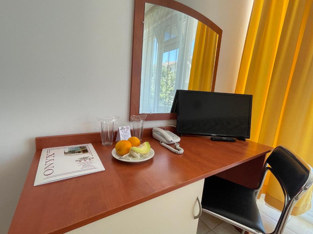 TV a/nebo společenská místnost v ubytování Hotel Onyx
