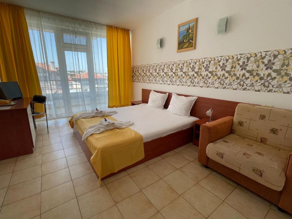 Postel nebo postele na pokoji v ubytování Hotel Onyx