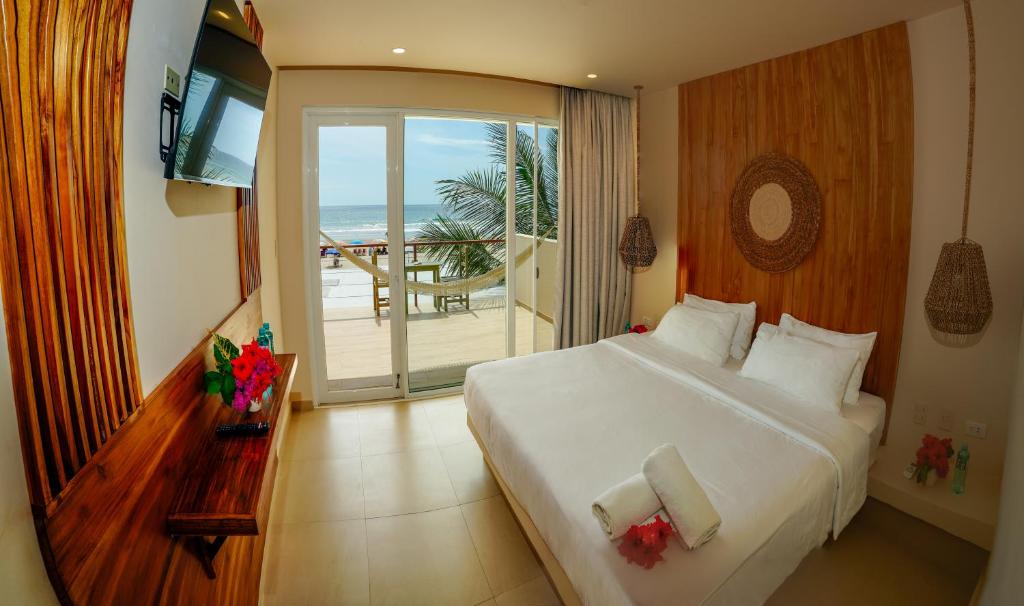 Postel nebo postele na pokoji v ubytování Hotel Kundalini