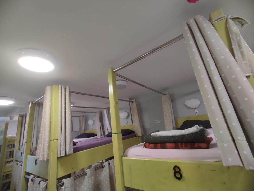 Postel nebo postele na pokoji v ubytování KGT House