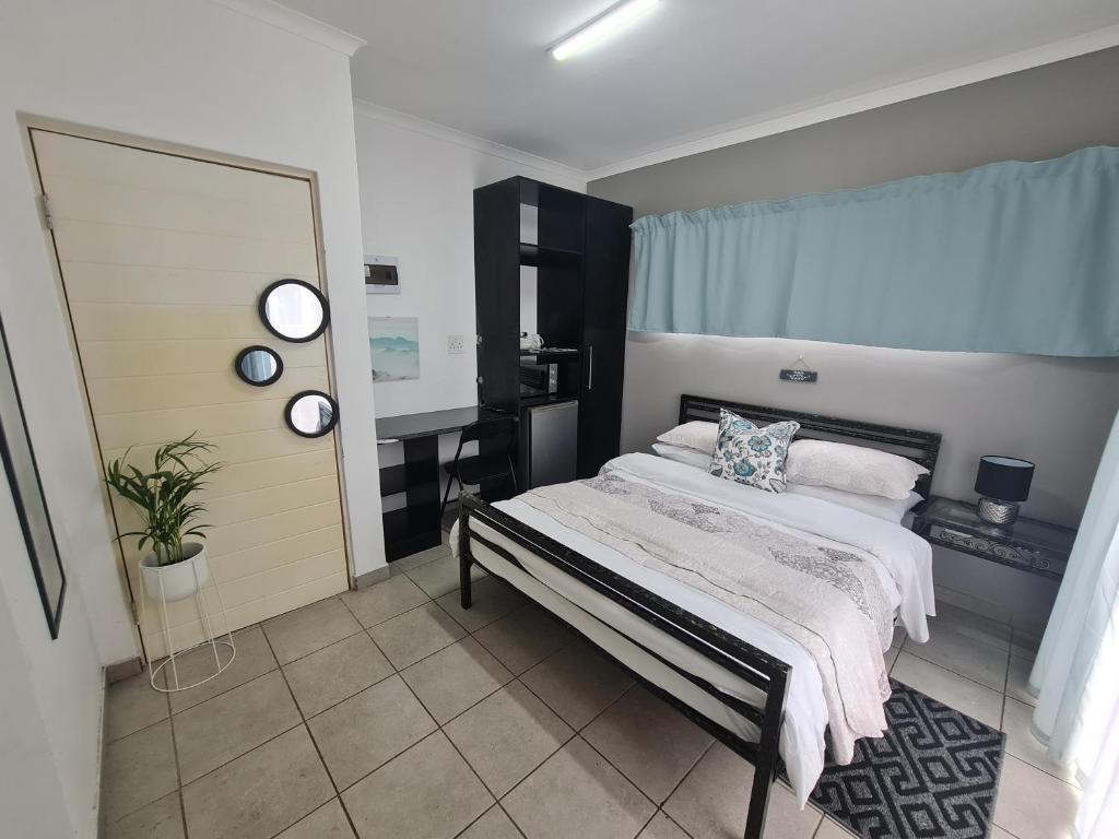 a bedroom with a bed and a large mirror at D on 78 in East London