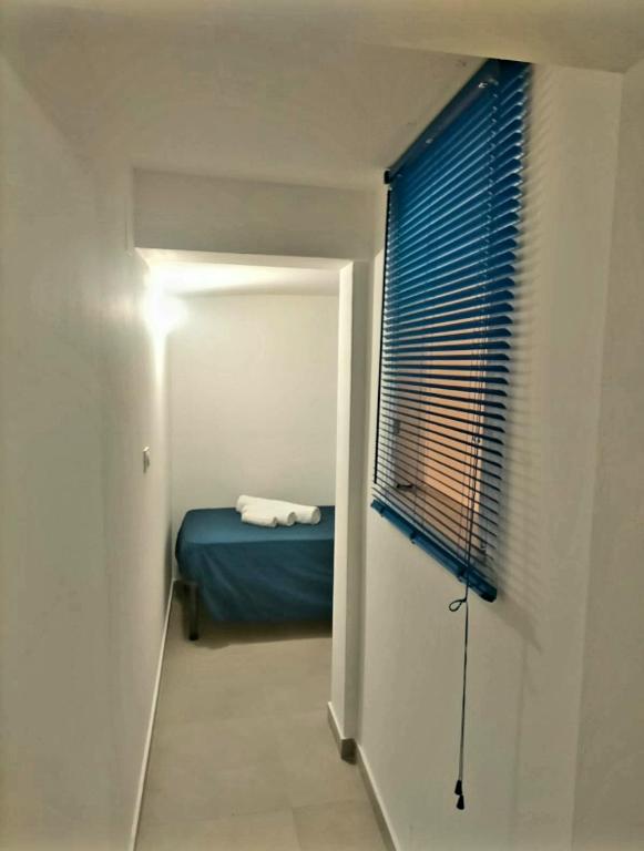 A bed or beds in a room at Calypso's Shell