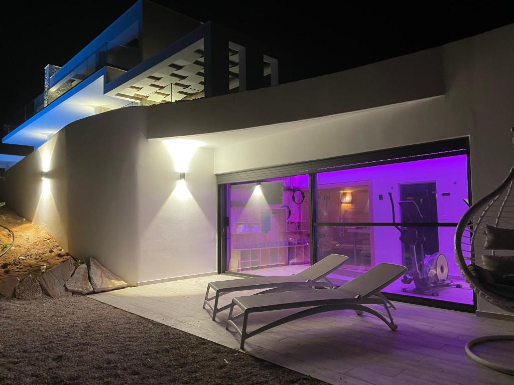 A balcony or terrace at KOA Spa Villa-Luxury villa in Gialova with own Spa