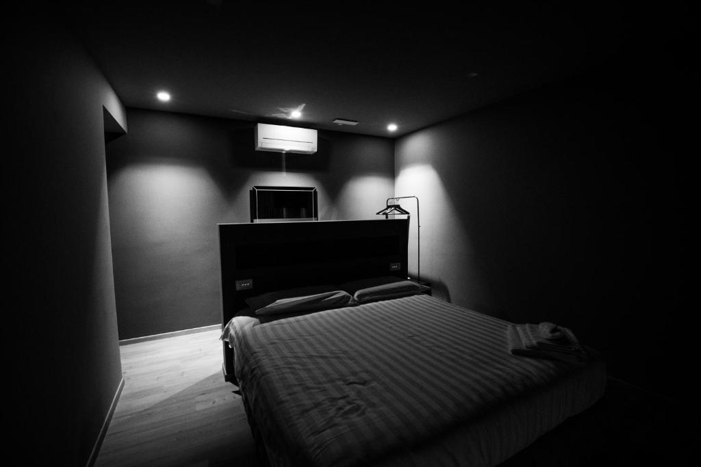 Postel nebo postele na pokoji v ubytování DiVino Rooms Deluxe