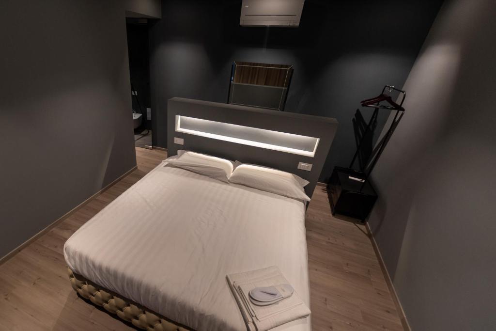 Postel nebo postele na pokoji v ubytování DiVino Rooms Deluxe