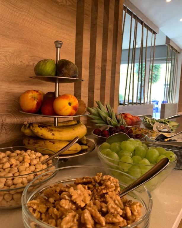 a buffet of fruits and vegetables on a table at MAR60 Apartments in Caorle