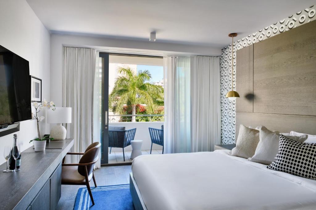 TV a/nebo společenská místnost v ubytování Kaskades Hotel South Beach
