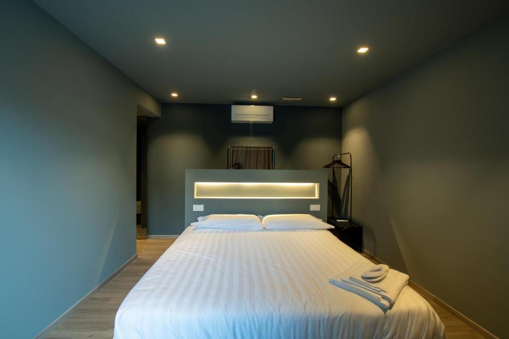 Postel nebo postele na pokoji v ubytování DiVino Rooms Deluxe