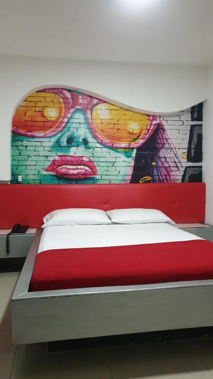 Postel nebo postele na pokoji v ubytování Kromatic Hostel