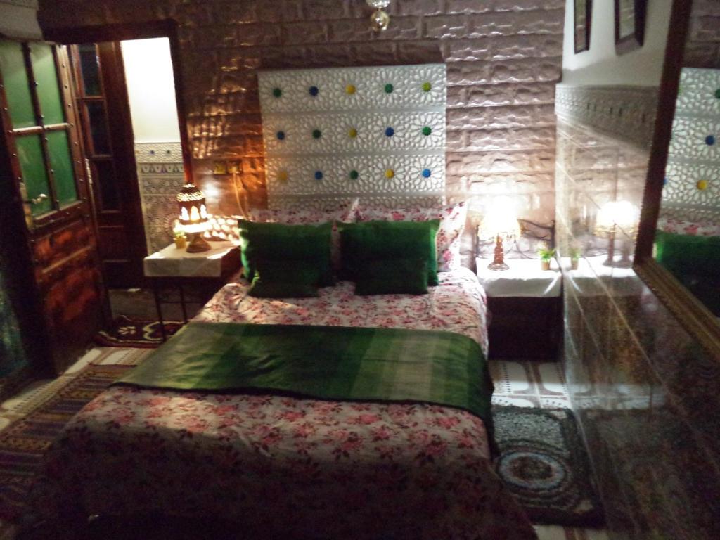 Postel nebo postele na pokoji v ubytování Dar Nouzha A