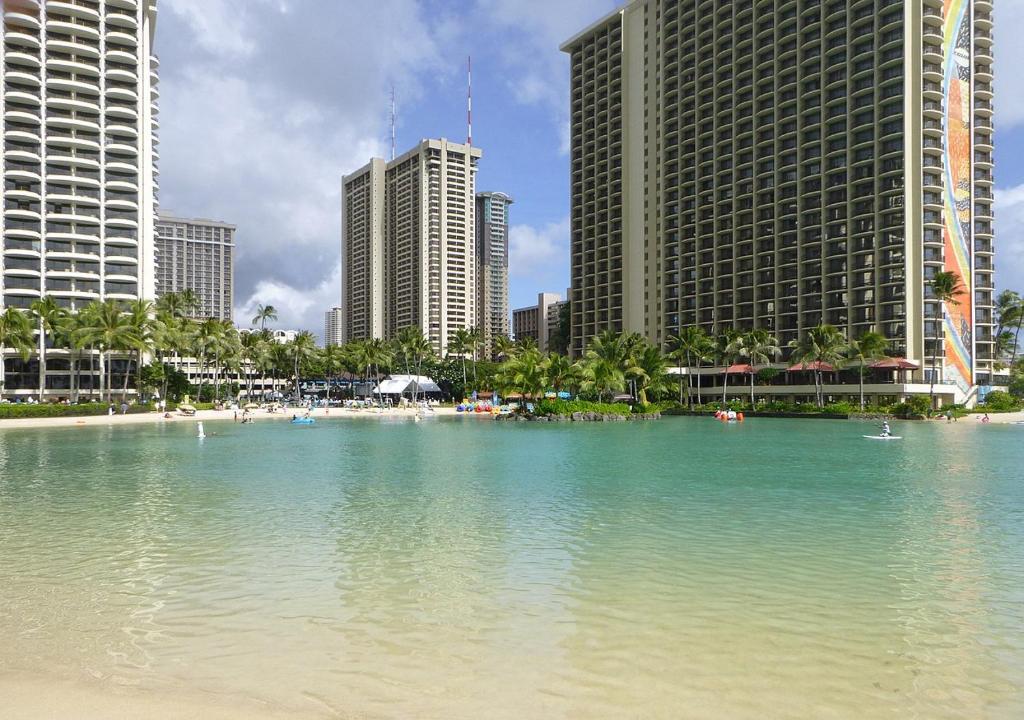 a large body of water in a city with tall buildings at Ocean and Mountain View Condo - Free Reserved Parking in Honolulu