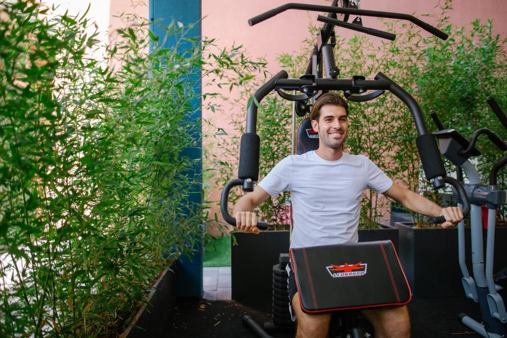 a man riding an exercise bike on a elliptical machine at MAR60 Apartments in Caorle