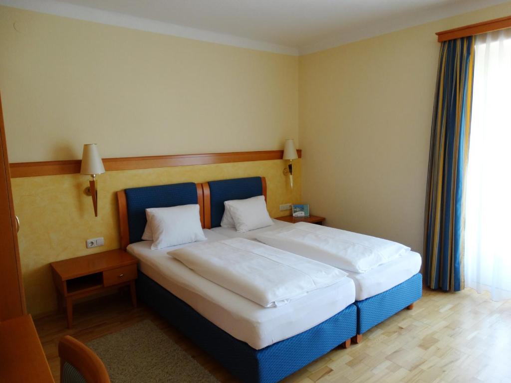 Postel nebo postele na pokoji v ubytování Hotel Locker & Legere