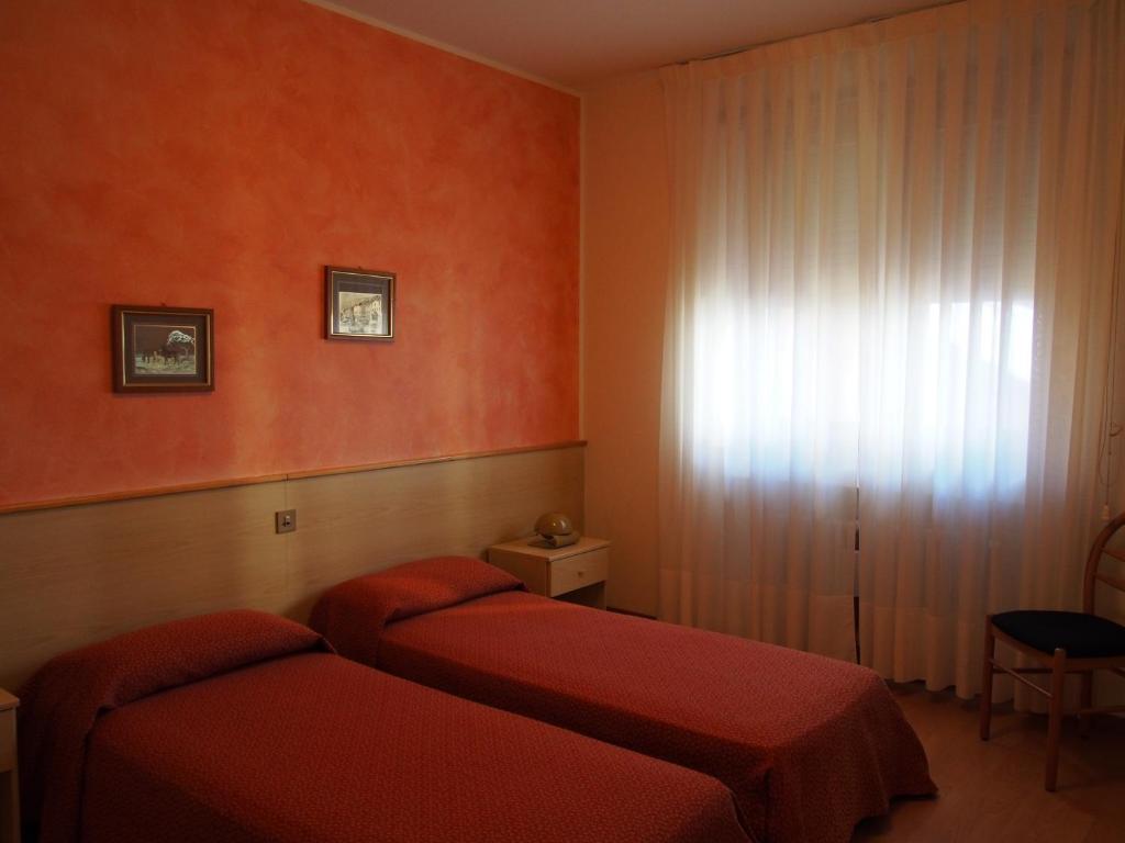 Postel nebo postele na pokoji v ubytování Hotel Belvedere
