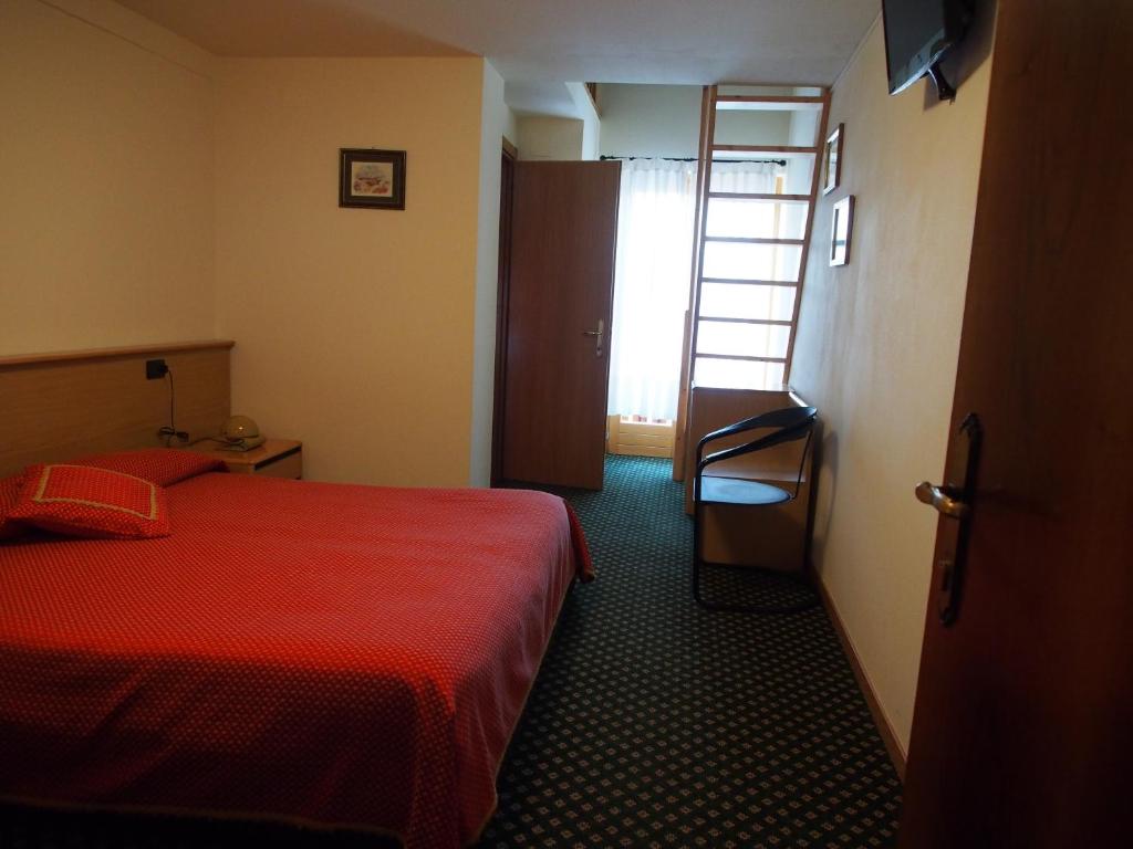 Postel nebo postele na pokoji v ubytování Hotel Belvedere