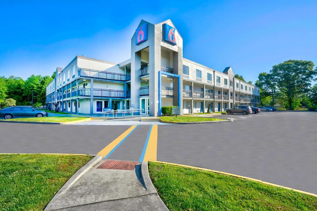 a large building with a clock on top of it at Motel 6 Virginia Beach in Virginia Beach