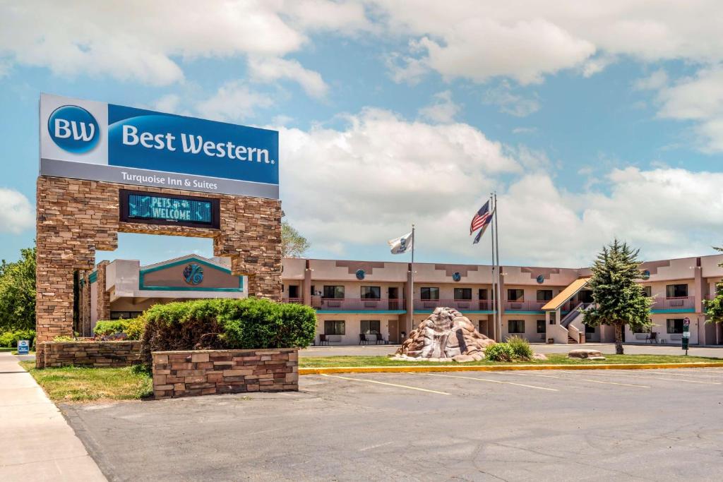 a building with a best western sign in front of it at Best Western Turquoise Inn & Suites in Cortez