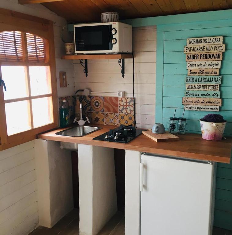 Kuchyň nebo kuchyňský kout v ubytování Beautiful Bungalow en VV con wifi,netflix cerca del mar
