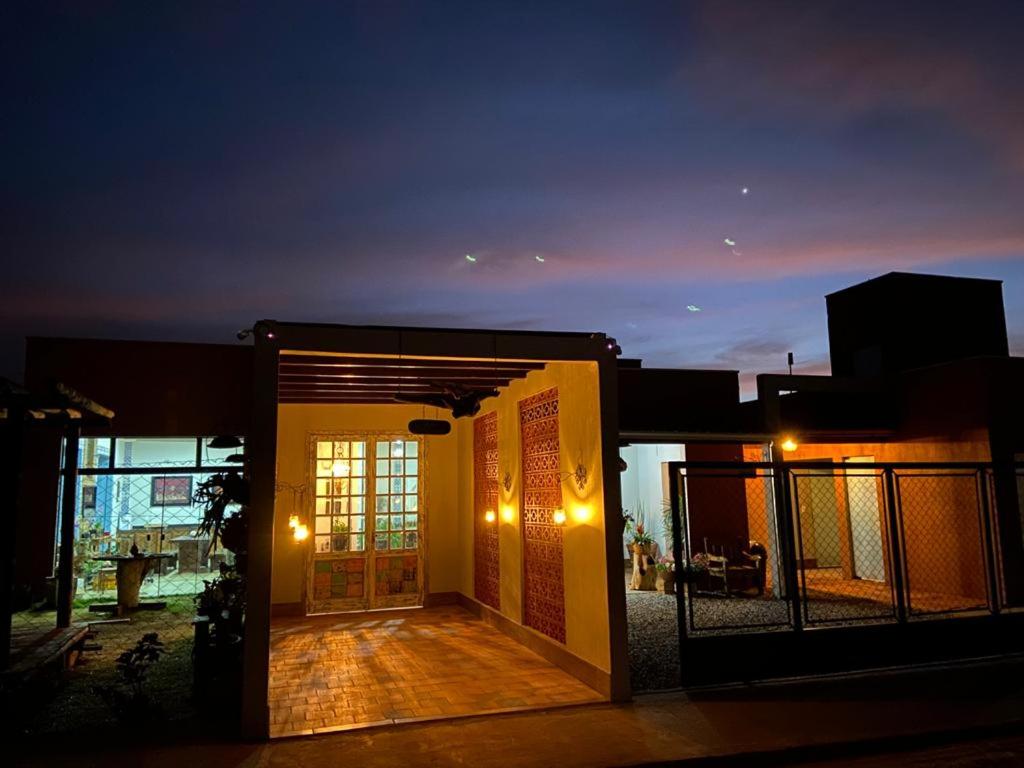 a front door of a house at night at Pousada Guardiã da Canastra in Vargem Bonita