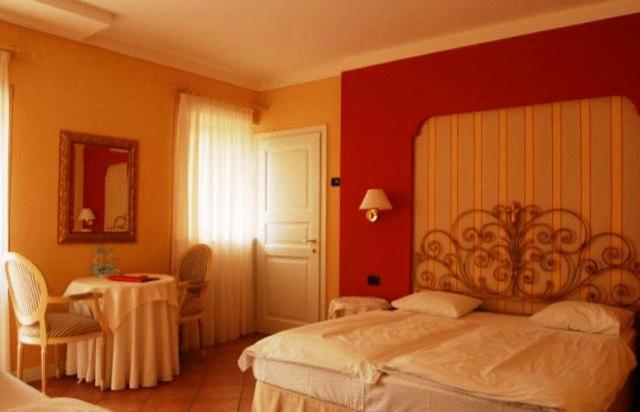 Łóżko lub łóżka w pokoju w obiekcie Hotel Casa Arizzoli