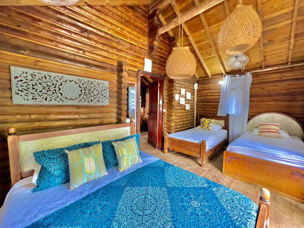 Postel nebo postele na pokoji v ubytování Mistica Island Hostel - Isla Palma