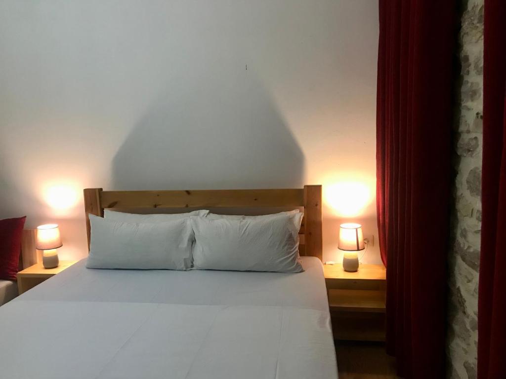 Postel nebo postele na pokoji v ubytování Vila ERI