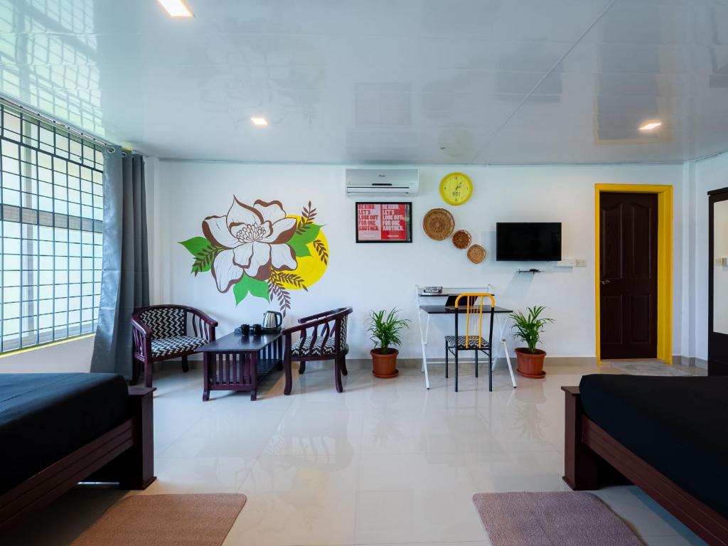 Televiisor ja/või meelelahutuskeskus majutusasutuses The Hosteller Coorg, Madikeri