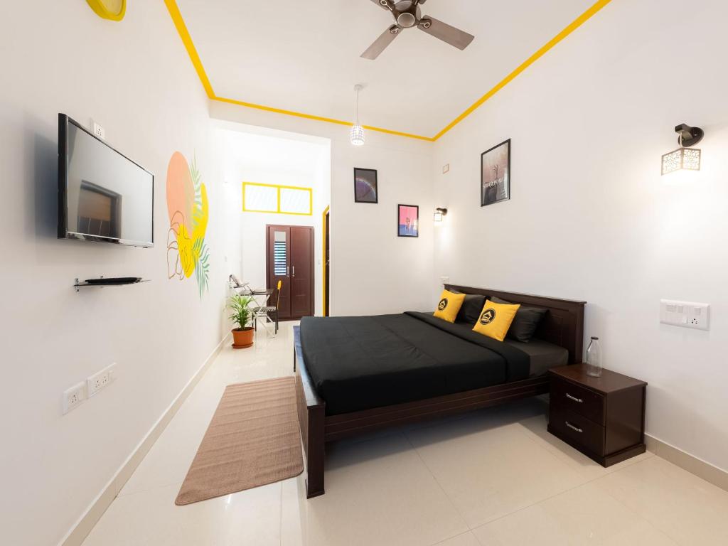 Televiisor ja/või meelelahutuskeskus majutusasutuses The Hosteller Coorg, Madikeri