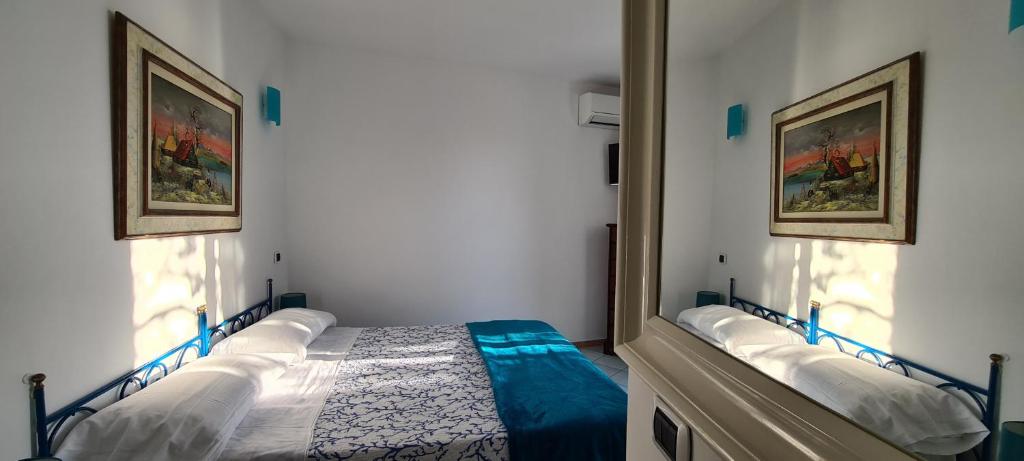 Postel nebo postele na pokoji v ubytování Guest House Villa Il Gabbiano