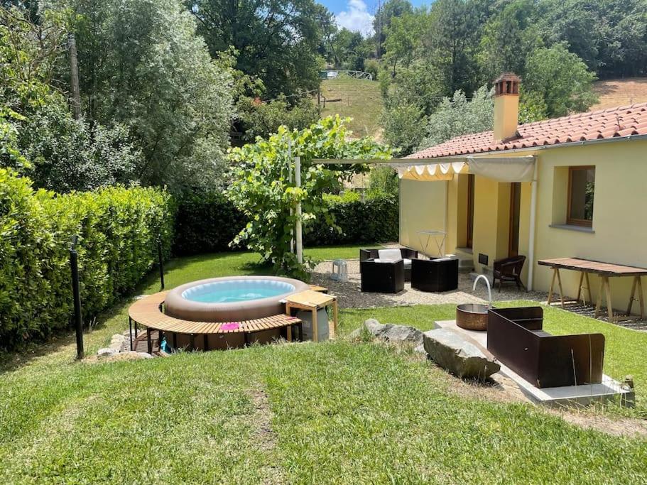 a backyard with a swimming pool and a house at Casa Barulli - Tuscany in San Giovanni Valdarno