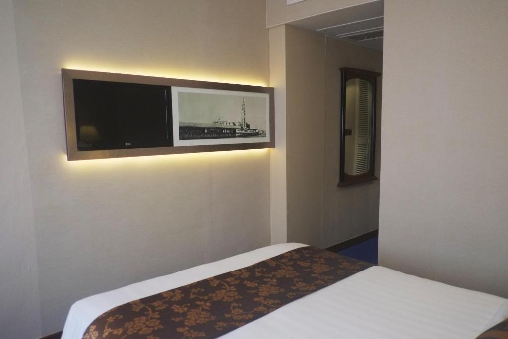 Voodi või voodid majutusasutuse The Kimberley Hotel toas