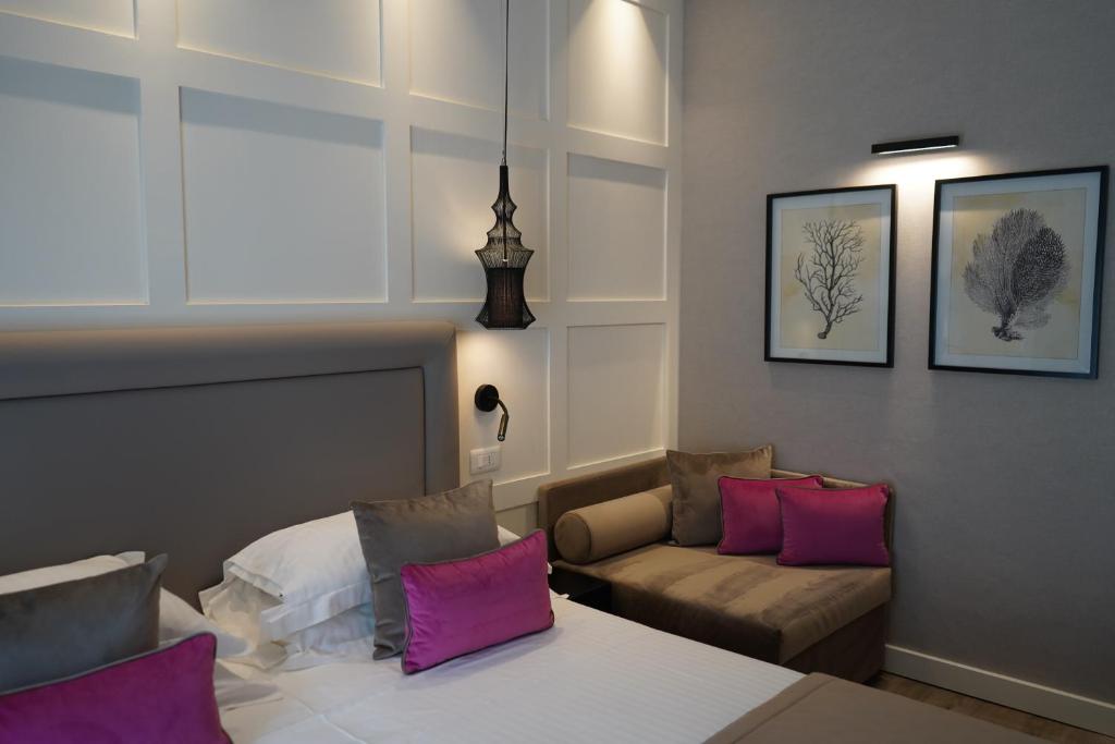 Postel nebo postele na pokoji v ubytování Hotel Lungomare