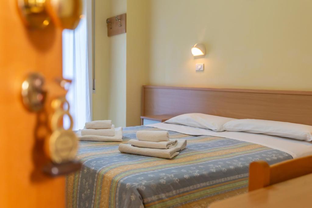 Postel nebo postele na pokoji v ubytování HOTEL VALPARAISO