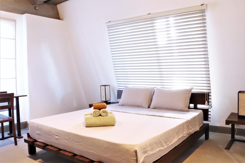 Postel nebo postele na pokoji v ubytování Asmara Urban Resort & Lifestyle Village Powered by ASTON
