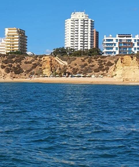 a body of water with buildings in the background at Vue Ocean in Portimão