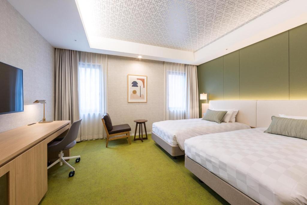 Postel nebo postele na pokoji v ubytování Kichijoji Excel Hotel Tokyu