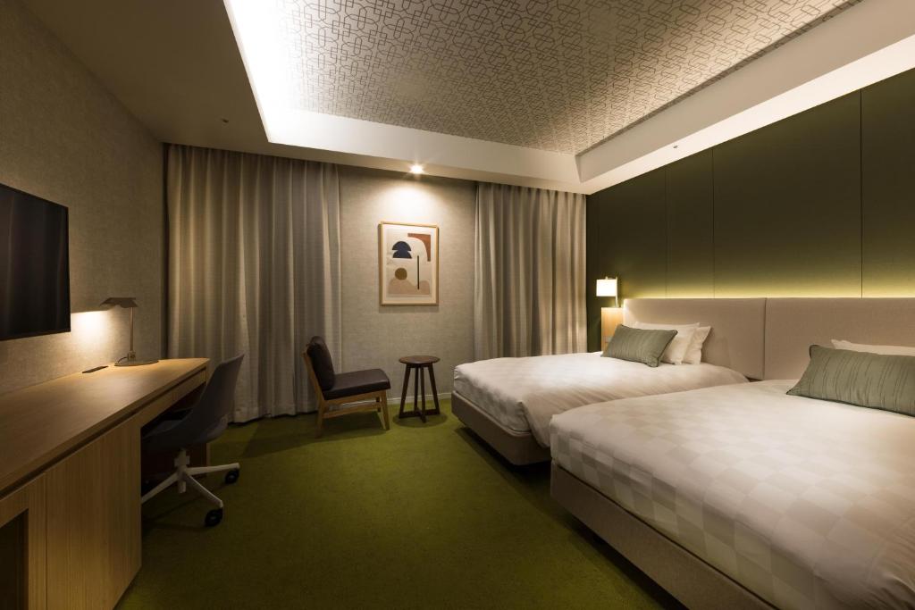 Postel nebo postele na pokoji v ubytování Kichijoji Excel Hotel Tokyu