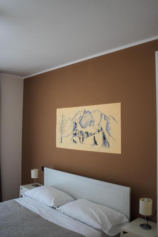 Łóżko lub łóżka w pokoju w obiekcie Hotel Fontaine Bleue